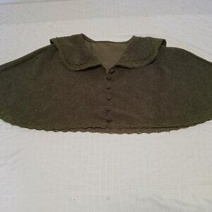 Khaki green corduroy cape with lace at the collar and hem, small fabric button